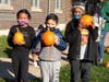 Matteson School first graders show off their pumpkins chosen from the patch, ready to be decorated and brought home for Halloween.