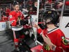 Teammates for a night, Patrick Kane and Peter Whelan go through their pre-game, fist bumping rituals.