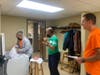 Center for Food Equity in Medicine founder, Ann Jackson (center) directs volunteers as they pack and prepare to deliver groceries.