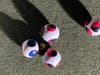 Final measurements by officials determine points in Bocce play at Rock Island Public House in Blue Island.