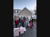 Members of the Kristofer family on the left greet Robbie Fakhouri and his family members, who arrive with wish list items in an Adopt a Family program. From left to right:
Charlie, Kristina, Toni, Enzo, Gianni, Jon, Robert, Elias, Jomana, Sienna & Henry.