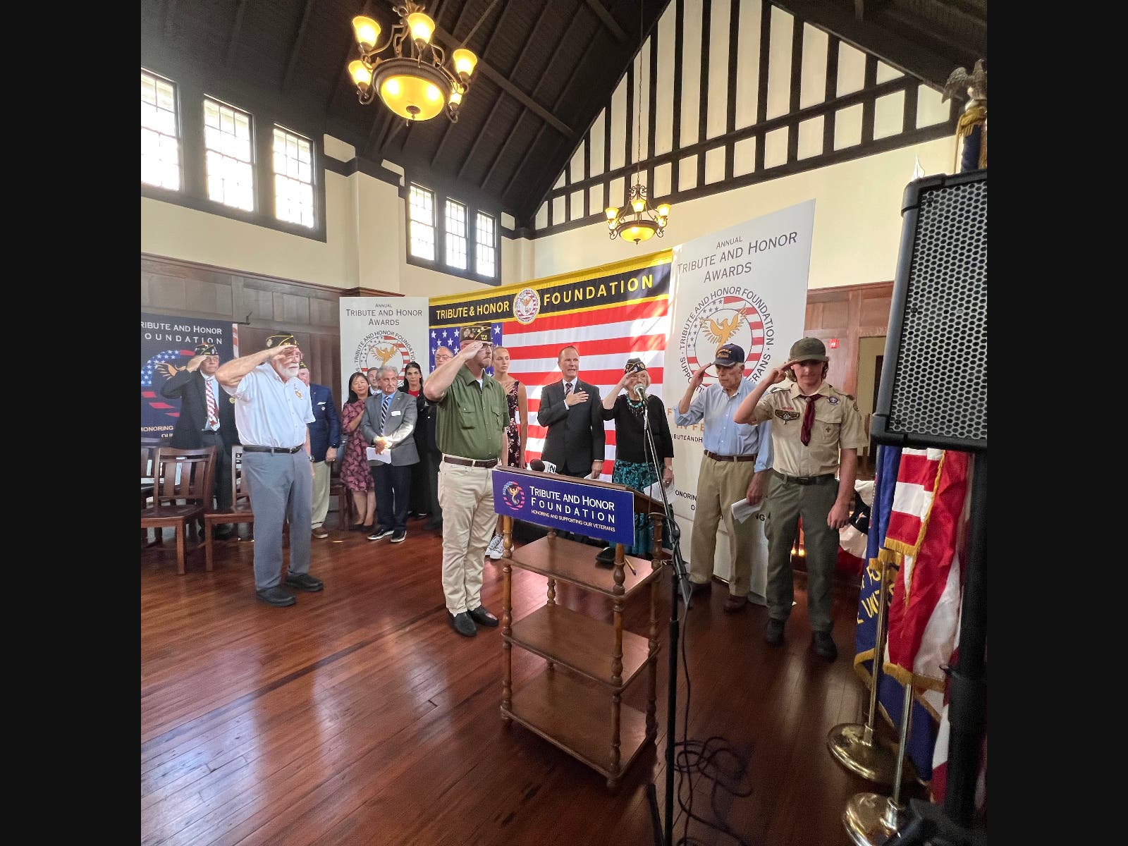 Commanders of local posts lead those gathered in the Pledge of Allegiance at the Tribute & Honor Foundation’s 2025 Announcement Event. The public is invited to attend this year’s free event on September 20 at 3:30 pm, at the North Shore Historical Museum.