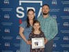 Steve Accepting his NH 2022 District Director Award with his wife and daughter