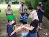 Karman Singh Gill, Webelos Cub scout pack 501 presenting Jenna Leigh-Lucy, guest speaker of the event, a beautiful rock he painted as a gift for her.