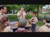 Den Leader Farhad Antia along with Karman Singh Gill, Webelos Cub Scout, of Pack 501 explaining what the Arrow means during the oath ceremony for Arrow of Light scouts. 