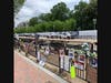 Photos of Black men and women killed by American police officers adorn a fence across from White House.