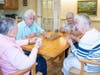 Marillac Residence residents enjoying a competitive game of cribbage