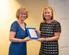 Lori Ferrante presents Emily Nardone, President, Wellesley Hills junior Women’s Club, with plaque recognizing the commitment of the organization to volunteerism at the Elizabeth Seton Residence.