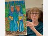 Jackie Baer holding one of the 40 drawings created while beating Coronavirus at the Elizabeth Seton Residence