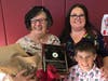 Heritage Award honoree Sue Burcham, left, is pictured with daughter Lindsey Burcham, and grandson, Lionel. 