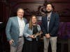 Chris McGuire, president of AMA Chicago, presents Lauren Gannon and Peter Briggs of Zeta Global with a 2026 Palmer Marketing Award in the Product or Service Launch category 