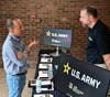 Cyrus Etemad-Moghadam, President and Founder of RPM Tech in Forest Hill, left, speaks with Jason Craley, Technology Transfer Specialist with the U.S. Army DEVCOM Army Research Laboratory, right, at the recent Technology Acceleration Summit. 