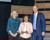 Barbara Richardson, director of Housing and Community Services, left, and and Bob Cassilly, Harford County Executive, right, congratulate BangTam Miller, the 2025 Harford’s Most Beautiful Ripple Effect Award winner. 