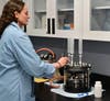 Environmental Chemist Leah Griffin demonstrates the use of the manual solid phase extraction unit, one step in the water sample testing process, during a tour by the county executive of the county’s PFAS lab at the Abingdon Water Treatment Plant.