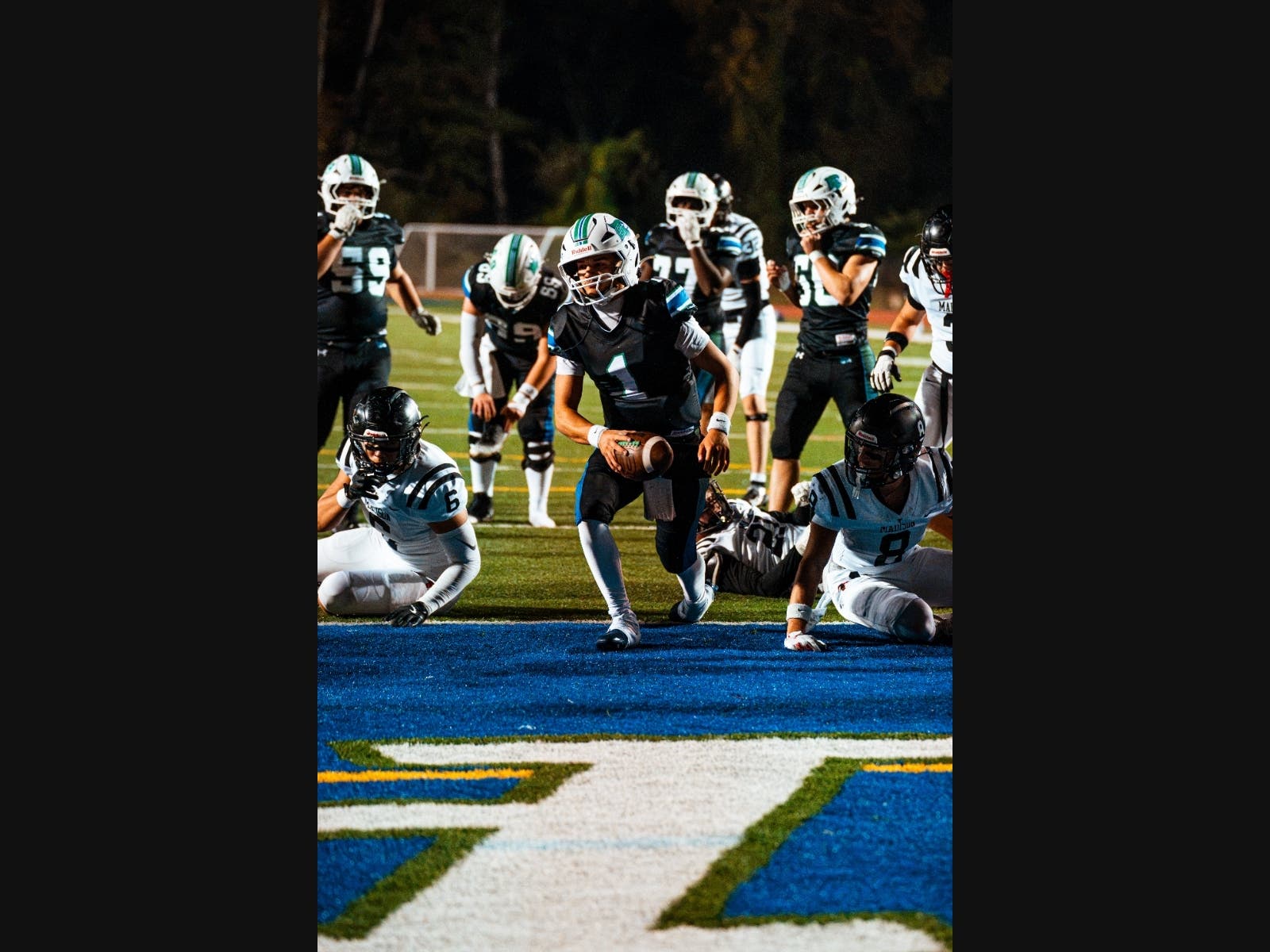 South Lakes quarterback Christian Wyatt (1) accounted for five touchdowns Friday night against Madison -- two through the air, and three, including this one, on the ground.