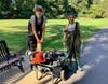 Acera students Ben Hines and Isabella Wheler spent a hour removing trash from the Aberjona River in Davidson Park on Wednesday, October 6. Among their most interesting finds in the water: a dog dish, a traffic cone, a traffic pole, and a football. 