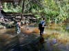 The students used waders, gloves, and reach extenders during the clean up.