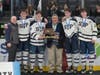 Eagle’s head coach Kristan Hanson and senior captains Tighe, Rosa, Vana and Doherty pose for a photo with Robert Baldwin and their well-earned trophy.