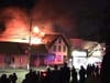 Concert-goers watch as the beloved theatre blazes through the night.