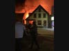 Firefighters from several Lakes Region towns work to fight the blazing fire.