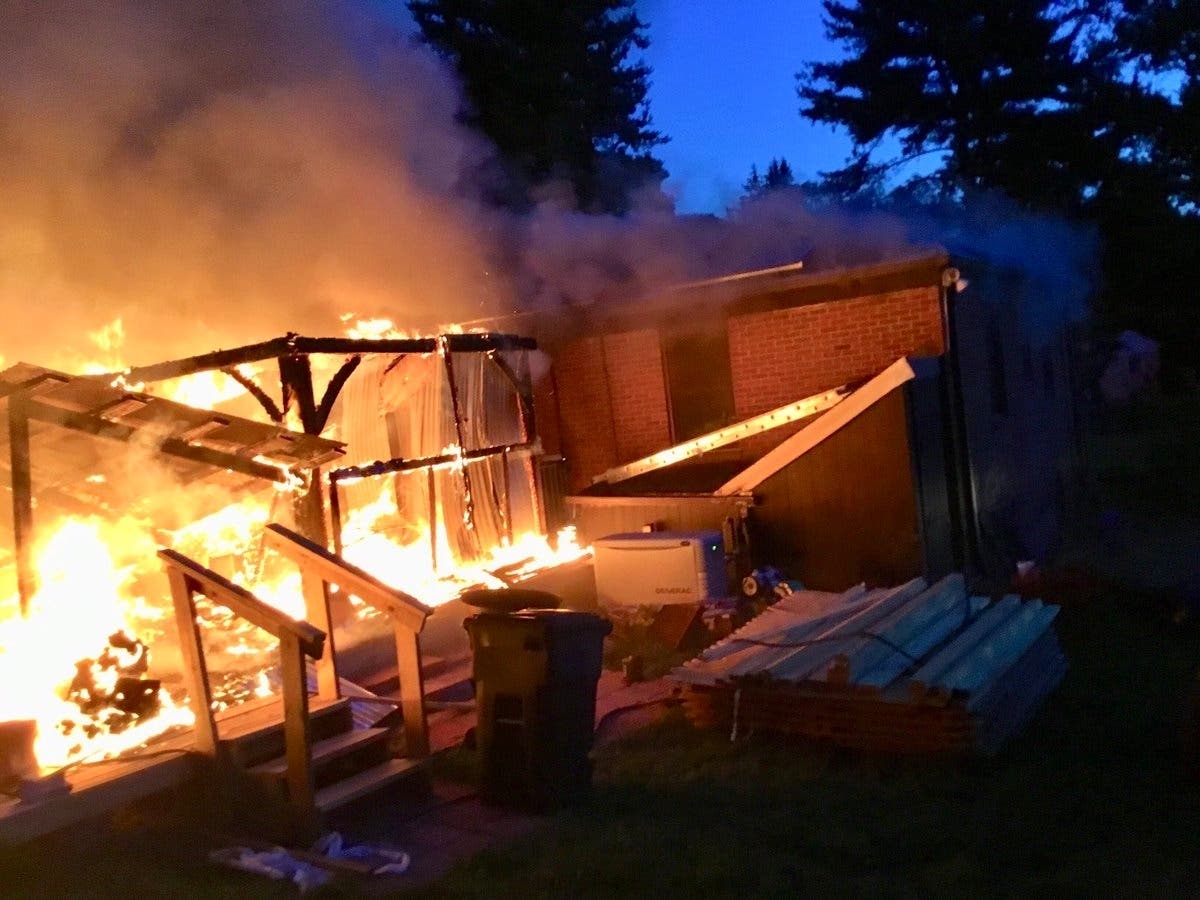 An off-duty police sergeant rescued a couple from a massive house fire in the Colesville area Tuesday morning.