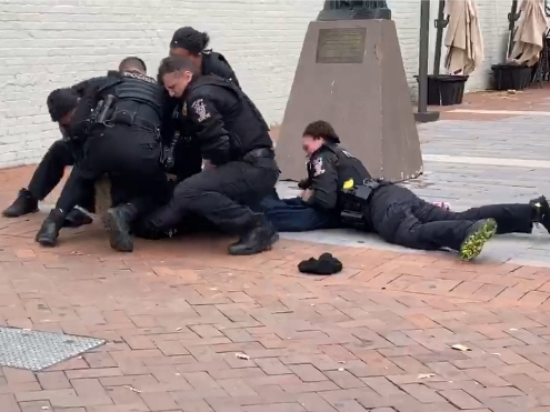 The man could be seen cursing at Montgomery County Thanksgiving Parade spectators and narrowly missing kids with his bicycle.