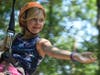 Girls enjoy the thrill of the zip line at Camp Amity Acres.
