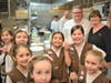 Chef David Burke, Girl Scouts CEO Eileen Higgins and Brownie Troop 60173 enjoy an afternoon of cooking at Drifthouse.