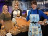 Julie LaBruto from Talula’s displays a mini croissant baked with Do-Si-Dos cookies with Stacy Mokes and owner Shanti Church.