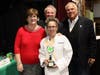 Girl Scout CEO Eileen Higgins, emcees Tim McLoone and Steve Bidgood present the People’s Choice Award to JoAnne Macalik from McLoone's Restaurants.
