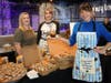 Julie LaBruto from Talula’s displays a mini croissant baked with Do-Si-Dos cookies with Stacy Mokes and owner Shanti Church.
