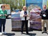 Girl Scouts of the Jersey Shore CEO Eileen Higgins, Fulfill CEO Kim Guadagno and OceanFirst Bank President, Central Region, George Destafney with 10,000 boxes of love for families in need.
