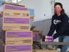 Stephanie Toal from OceanFirst helps prepare the delivery of 10,000 boxes of Girl Scouts Cookies to cheer families served by Fulfill.