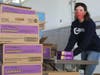 Stephanie Toal from OceanFirst helps prepare a delivery of 10,000 boxes of Girl Scouts Cookies to cheer families served by Fulfill.