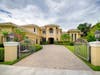 5,901 AC sq. feet, 5 bedrooms, 5 full, 2 half baths, 4-car garage, lake views on over a half acre