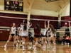 Ossining varsity volleyball team celebrates after a point 