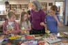 Lower School students take part in an annual book recycling activity organized by Librarian Jean Stevens.