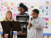  Lucy Anne Kurtz of Darien, Kayla Mouzon of Norwalk Ethan Brown-Toussaint of Stamford emceed the Lower School assembly.