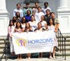 Horizons High School Class of 2022 at their graduation and Alumni Induction ceremony. This past year 100% of our seniors graduated on time and 96% were enrolled in college this fall. 
