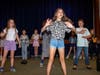The 45-minute production also featured choreography led by sixth-grader Oliva Back (in front) and music directed by fifth-grader Ben Kelsey (not pictured).