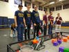 Luke Barasch, Oliver Chamberlin and Duncan Craine prepare for a match at the tournament before winning the Tournament Finalist Award. All three students are sophomores at Weston High School and have been on the VEX Robotics team for four years.
