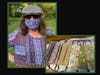 Quilter Marcia Thomas strikes a pose in one of her masks.