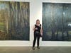 Artist Elaine Miller relaxes before the opening reception for "Remnants and Remains."