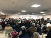 Every seat in the Blais room in the Callahan center was taken, with people standing along the edges of the room as well.
