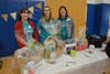 Employees of Ascentria set up raffle baskets for clients at the annual Spring Fling.