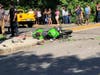 The motorcycle was strewn in the street after the accident that shut down Beaver Street.
