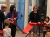 Students and staff gathered for a ribbon cutting, unveiling the center's first permanent location.