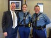 Major Joseph King (left), Trooper Stephanie Devlin (center), Lieutenant James Devlin (right).