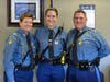 Colonel Kerry Gilpin (left), Trooper Stephanie Devlin (center), Lieutenant James Devlin (right).
