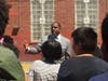 State Sen. Kevin Parker visits the school where he will allocate $500,00 to fix the play yard.